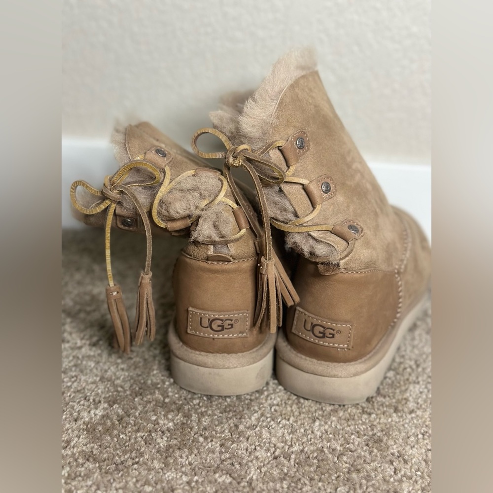 Used Ugg Med-Low boots. Still comfortable and useable!
